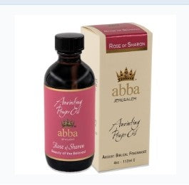 A bottle of Abba Spillman Rose of Sharon aromatic fragrance oil next to its beige packaging box, set against a plain white background.